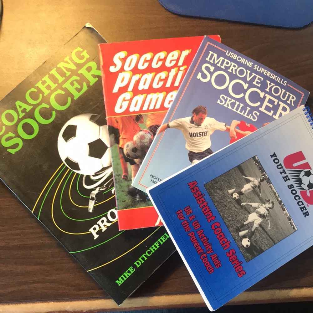 Four (4) Coaching Soccer books